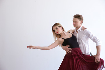Fototapeta na wymiar Couple of young dancers on white background