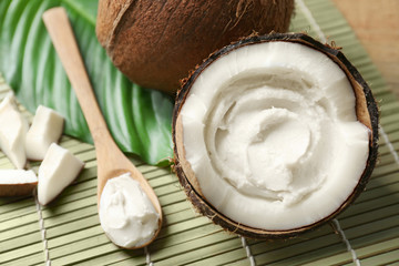 Coconut cream in nut on bamboo mat