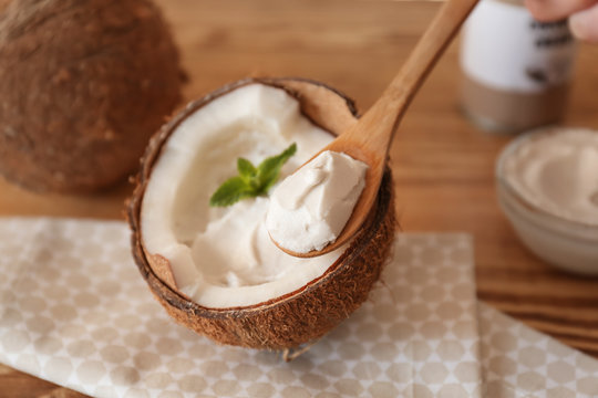 Coconut cream in wooden spoon, closeup