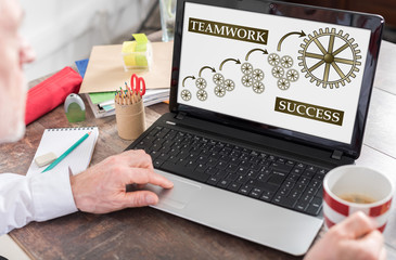 Teamwork success concept on a laptop screen