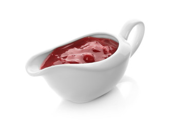 Delicious cranberry sauce in boat on white background