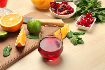 Ingredients for mixing Tequila Sunrise cocktail on table