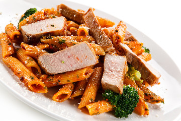 Pasta with vegetables on white background