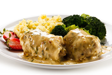 Roast meatballs with mashed potatoes and broccoli on white background
