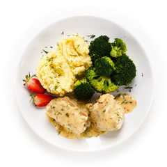 Roast meatballs with mashed potatoes and broccoli on white background