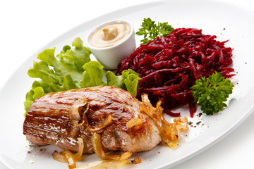 Grilled meat with beetroots on white background