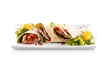 Spring rolls - wraps with meat and vegetables on white background