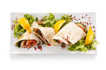 Spring rolls - wraps with meat and vegetables on white background