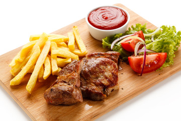 Griled meat with french fries on white background
