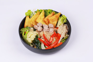 Crisy wonton and meat ball in Chinese kale soup .