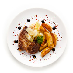 Grilled steak with french fries on white background