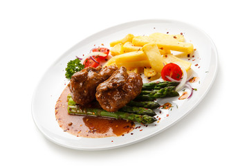 Wrapped pork chop with french fries and asparagus on white background