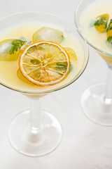 Citrus cocktail with ice close-up.