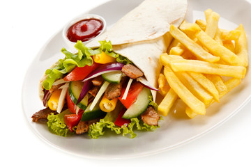 Tortilla wrap with french fries on white background