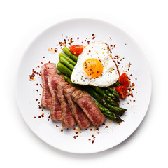 Grilled steak - fillet mignon with asparagus and fried egg