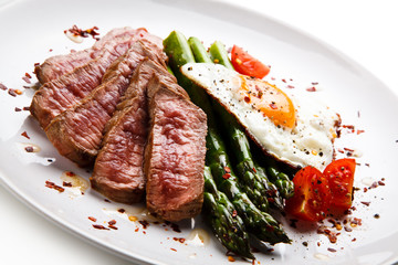 Grilled steak - fillet mignon with asparagus and fried egg