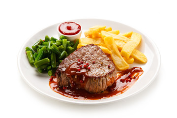 Grilled beefsteak with french fries on white background