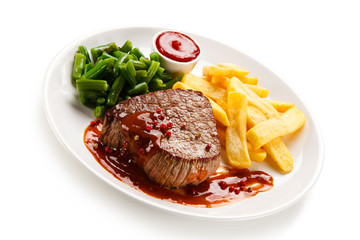 Grilled beefsteak with french fries on white background