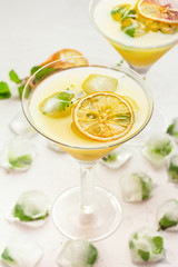 Citrus cocktail and ice with mint.