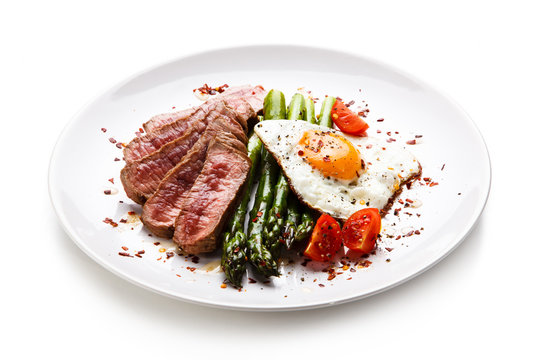Grilled steak - fillet mignon with asparagus and fried egg