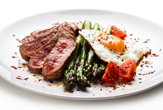Grilled steak - fillet mignon with asparagus and fried egg