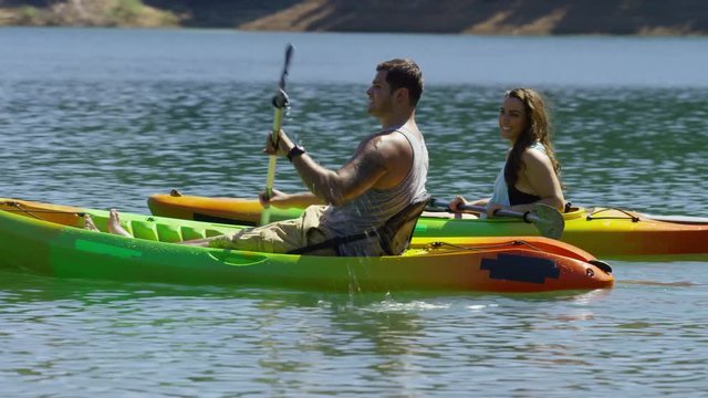 Couple kayaking in lake