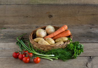 Basket of vegetables on the wood background