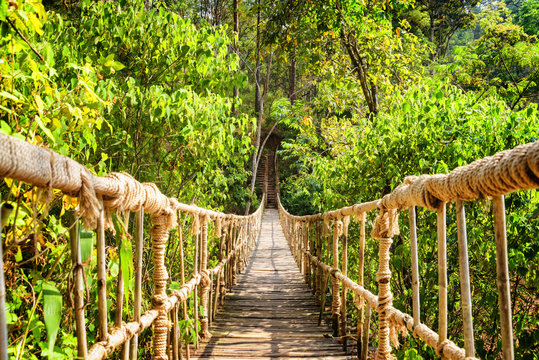 Fototapeta Beautiful footbridge made from rope and bamboo