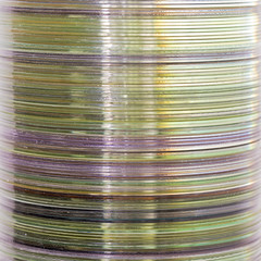 Stack of old compact discs, abstract close-up background