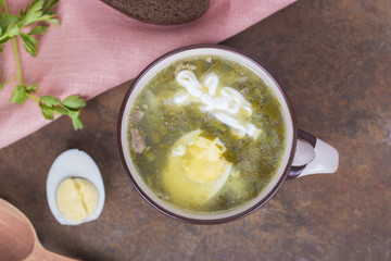 Soup of sorrel and young greens with egg