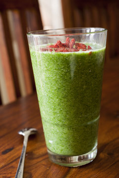 healthy spinach smoothie in a high glass