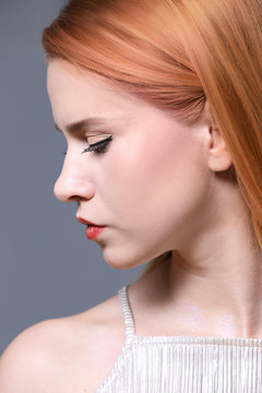Young woman with strawberry blonde hair, closeup