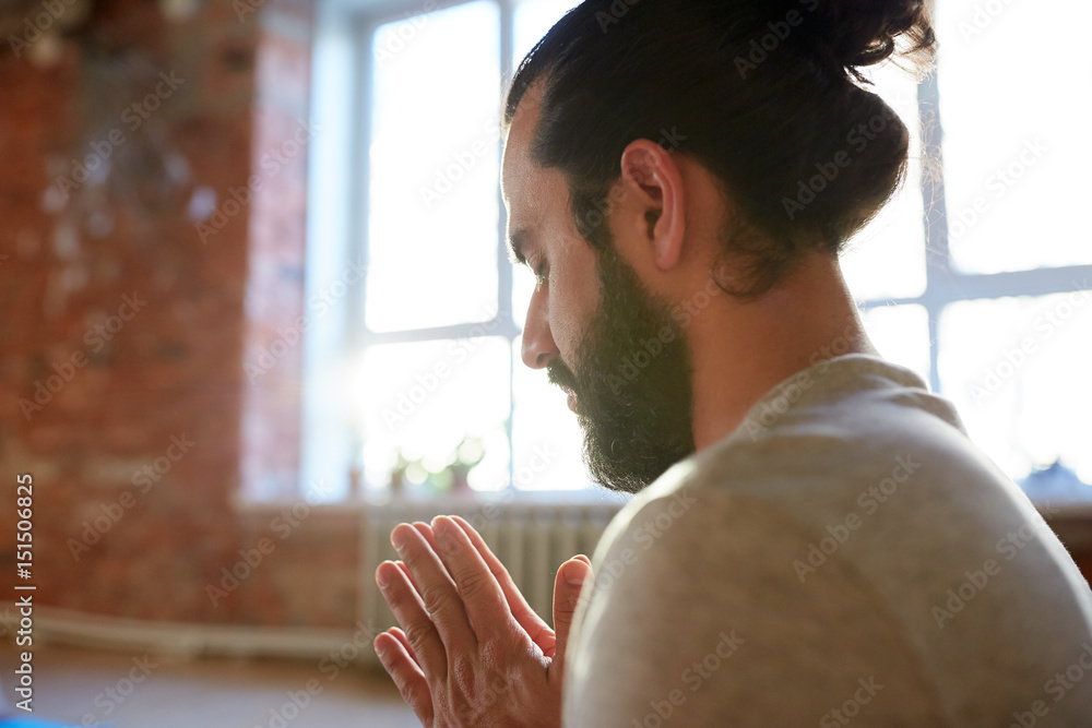 Canvas Prints close up of man meditating at yoga studio