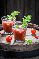 Cold bloody mary cocktail with tomatoes and celery
