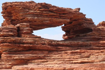 Natural window in red rock in Kalbarri National Park, Western Australia