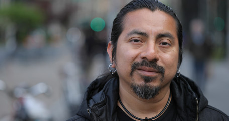 Hispanic Latino man in city face portrait