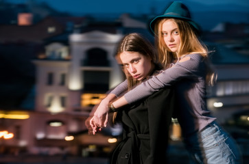 night city with girl, woman in black coat and hat