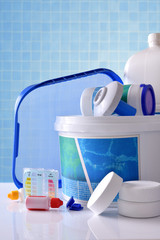 Chemical cleaning products for pool with blue mosaic background vertical
