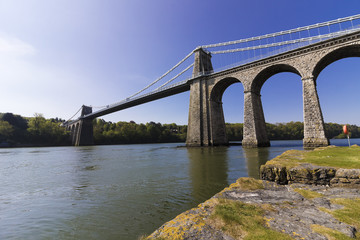 View of the historic Menai Suspension Bridge spanning the Menai Strait, Anglesey, North Wales 