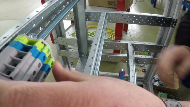 The assembling of electric fuses in fuse box. No face. Close-up. 4K.