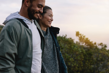 Smiling couple hiking in countryside