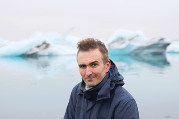 Man stand in front of Icebergs