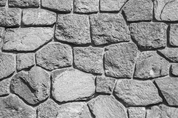 Rough gray stone wall, background texture