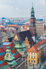 Obraz premium roofs and towers of Wroclaw - bird eye view of colorful roofs of old town with city hall tower, Wroclaw, Poland