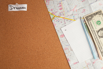 Travel planning concept: map, dollars on wooden background, front view with minimal style, copy space, traveling concept
