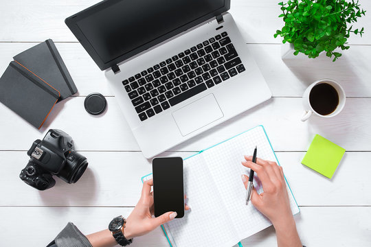 Overhead view of businesswoman working at computer in office