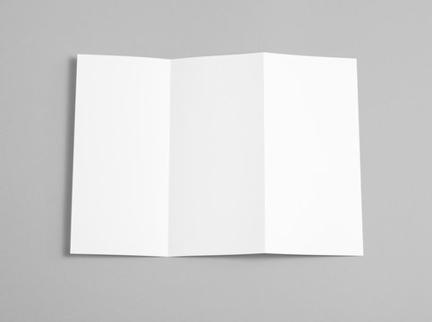 Blank folding page booklet on grey background.