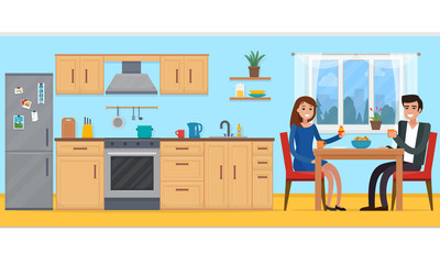 Couple in kitchen with furniture.