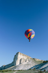 Fototapeta na wymiar Colorful Hot Air Balloon over Mountains