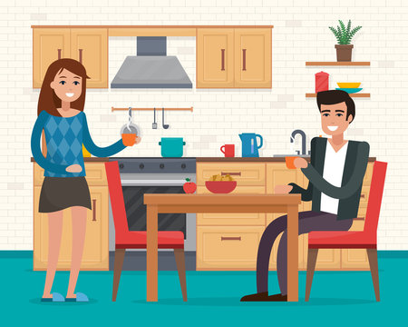 Couple in kitchen with furniture.